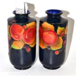 A pair of Shelley pomegranate vases, 19cm high Chip to the base of one, overall scuffing and wear,