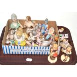 A tray of ceramics including two Goebel figures and a collection of pin cushion doll torsos