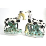 Pair of 19th century black and white greyhounds with rabbits Dog one; back leg missing to one and