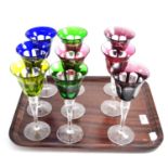 Twelve assorted coloured hock glasses Chips to the upper rim of two of glasses, otherwise slight