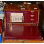 A Victorian oak fall front stationary chest