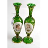 A pair of Bohemian green glass vases relief decorated with oval portraits, 26.5cm high Gilt