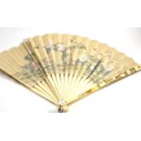 A 19th century Japanese Shibayama fan, ivory sticks and guards inlaid with mother of pearl flower