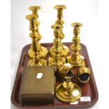 Two pairs of brass candlesticks, another single example, other brass and souvenir spoons