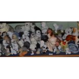 A large quantity of assorted pottery and composition Old English Sheep dog figures