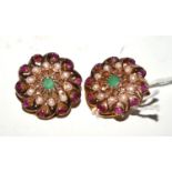 A pair of Victorian clips set with emerald, rubies and seed pearls