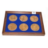 Framed display enclosing six medallions of Joseph B Strousse, W J Wilgus, John Smeaton etc