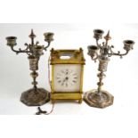 Brass cased carriage clock and a pair of Continental plated candelabra