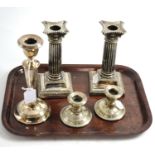 A pair of silver plated candlesticks, pair of silver dwarf candlesticks and another silver