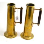 Two brass jugs with wooden handles, heart shaped mounts of Voysey design