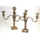 Pair of silver candelabra (loaded bases) Repairs to both arms on one of candlesticks, also repair