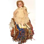 Bisque socket head doll with blue side glancing eyes, lace dress, bonnet and a tent hanging (2)