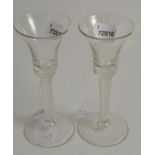 Near pair of 18th century drinking glasses 17cm high, both have chips to the footrim and slight wear