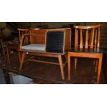 A set of four Elliott's of Newbury teak dining chairs, slat backs, black vinyl seats, labelled,