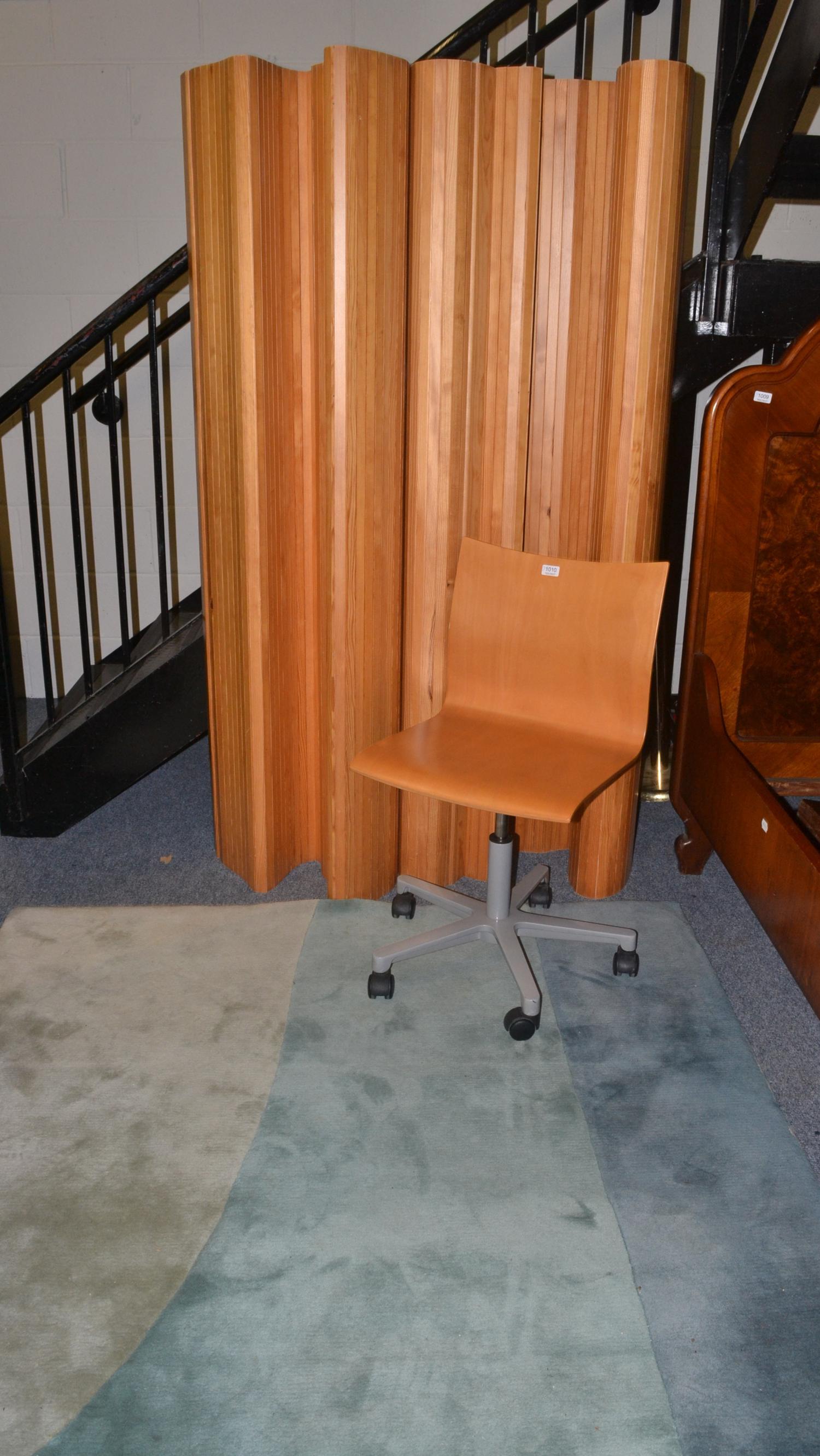 A wool carpet, two Habitat folding screens and an Ikea chair