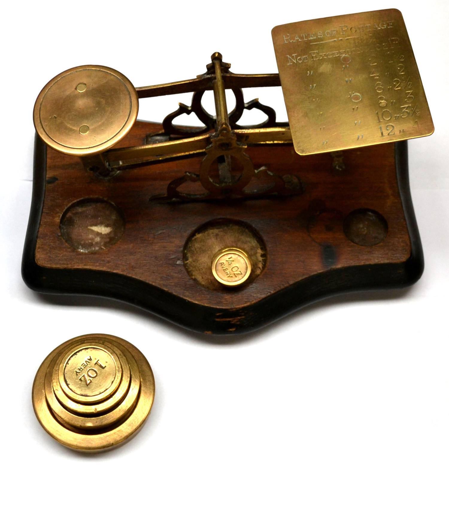 Postal Scales brass scales on wooden base with one pan engraved with postal rates up to 12oz, 4d;