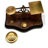 Postal Scales brass scales on wooden base with one pan engraved with postal rates up to 12oz, 4d;