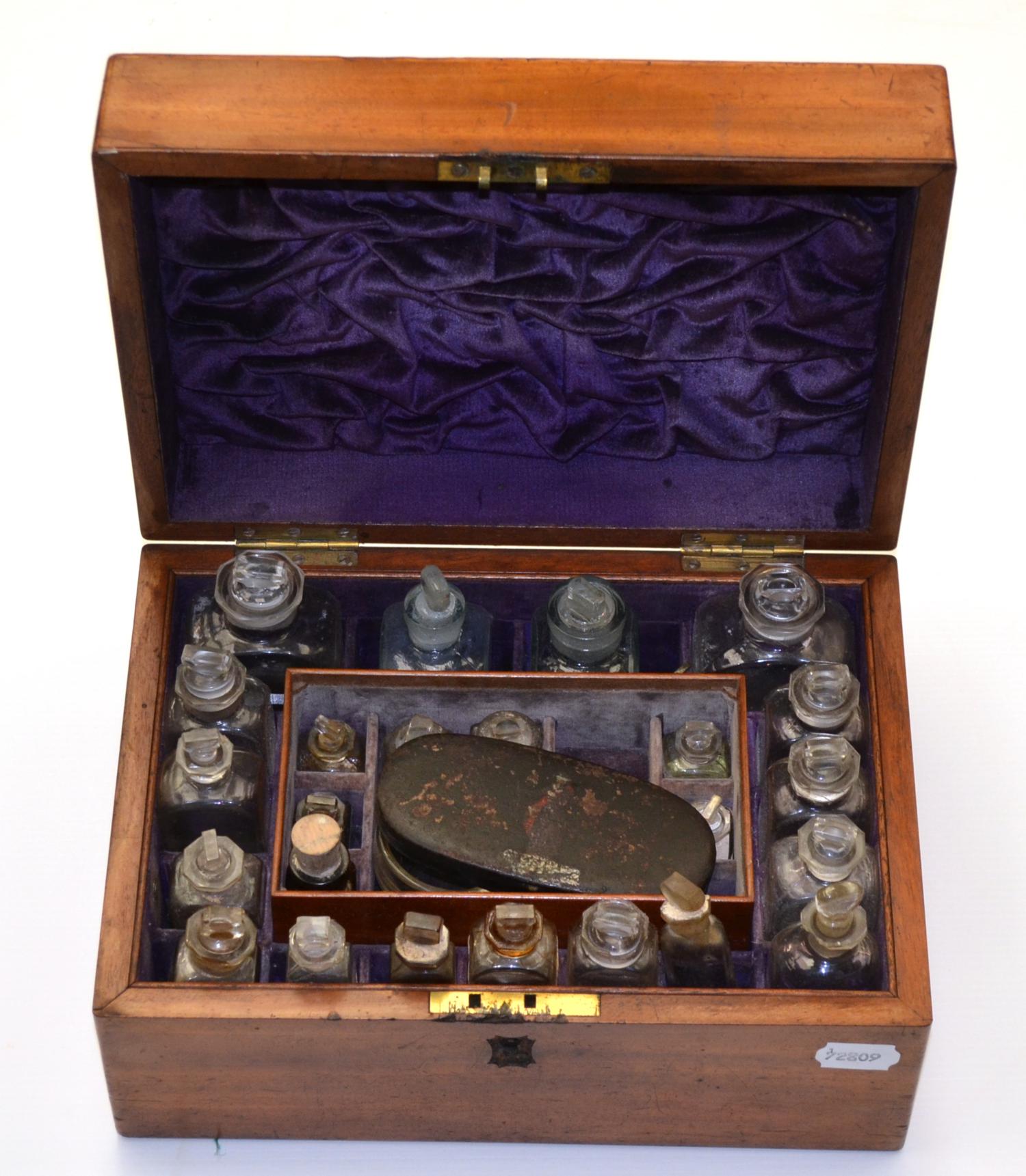 Apothecary Chest containing twenty four glass bottles in fitted and lined mahogany case with brass