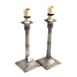Pair of silver candlesticks (adapted for electricity)