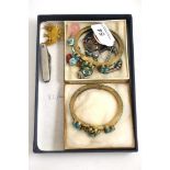 A group of assorted jewellery including; a silver brooch, a Scottish hardstone brooch, a rose quartz