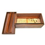 Mahjong games set Tiles are plastic on a wooden base