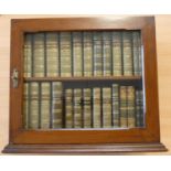 Desk Bookcase Twenty-four calf bound small books, including Moliere, Pope, Milton, Cowper, Walton'