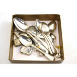 Seven Georgian silver spoons, assorted silver and plated vestas, a pill box, plated caddy spoon