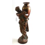 An early 20th century copper figure of a water carrier, now as a lamp