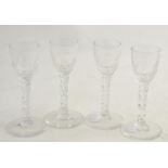 A set of four 18th century ale glasses with faceted stems  Overall good condition.
