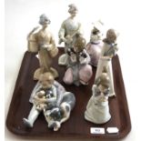 A quantity of Spanish porcelain figures comprising of three Lladro figures, one Nao figure and two