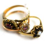 A 9ct gold sapphire and opal ring, a 9ct gold ruby and seed pearl ring and another