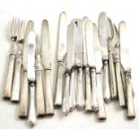 A quantity of silver handled fruit knives and forks