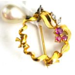 Pearl drop earring and a circular brooch