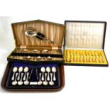 A cased set of twelve silver teaspoons, a cased set of fruit knives and forks for a six place