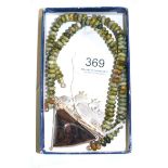 A jasper necklace, green and brown beads with a central pendant in a brown and black colours with