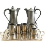 A pair of modern pewter flagons together with four pewter tankards and a silver-plated tea tray by