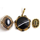 A sardonyx mourning brooch, a sardonyx pendant and another mourning brooch (3)