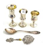 A Russian silver spoon, Continental pierced spoon impressed '800' and three small silver pedestal