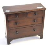 A mahogany miniature chest of drawers