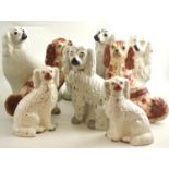 Four pairs of Staffordshire spaniels (on two trays)