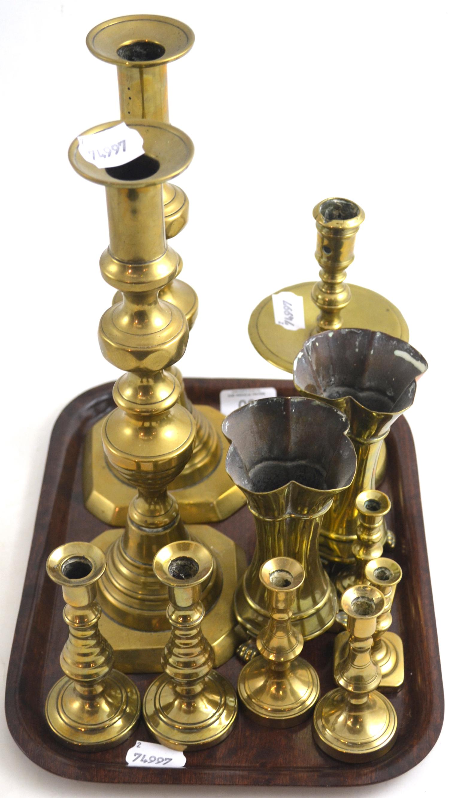 A group of 19th century brass candlesticks including a Heemskerk style candlestick