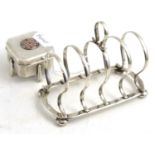 A silver five-bar toast rack and a Chinese silver box and cover with enamel mount