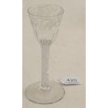 An 18th century air twist stem glass with etched detail  Good condition .