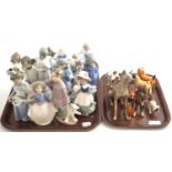 A quantity of ceramic models and figures including Lladro, Nao, Beswick, Royal Doulton etc (on two