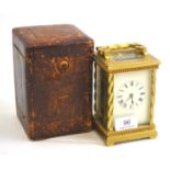 A brass striking carriage clock in a fitted case