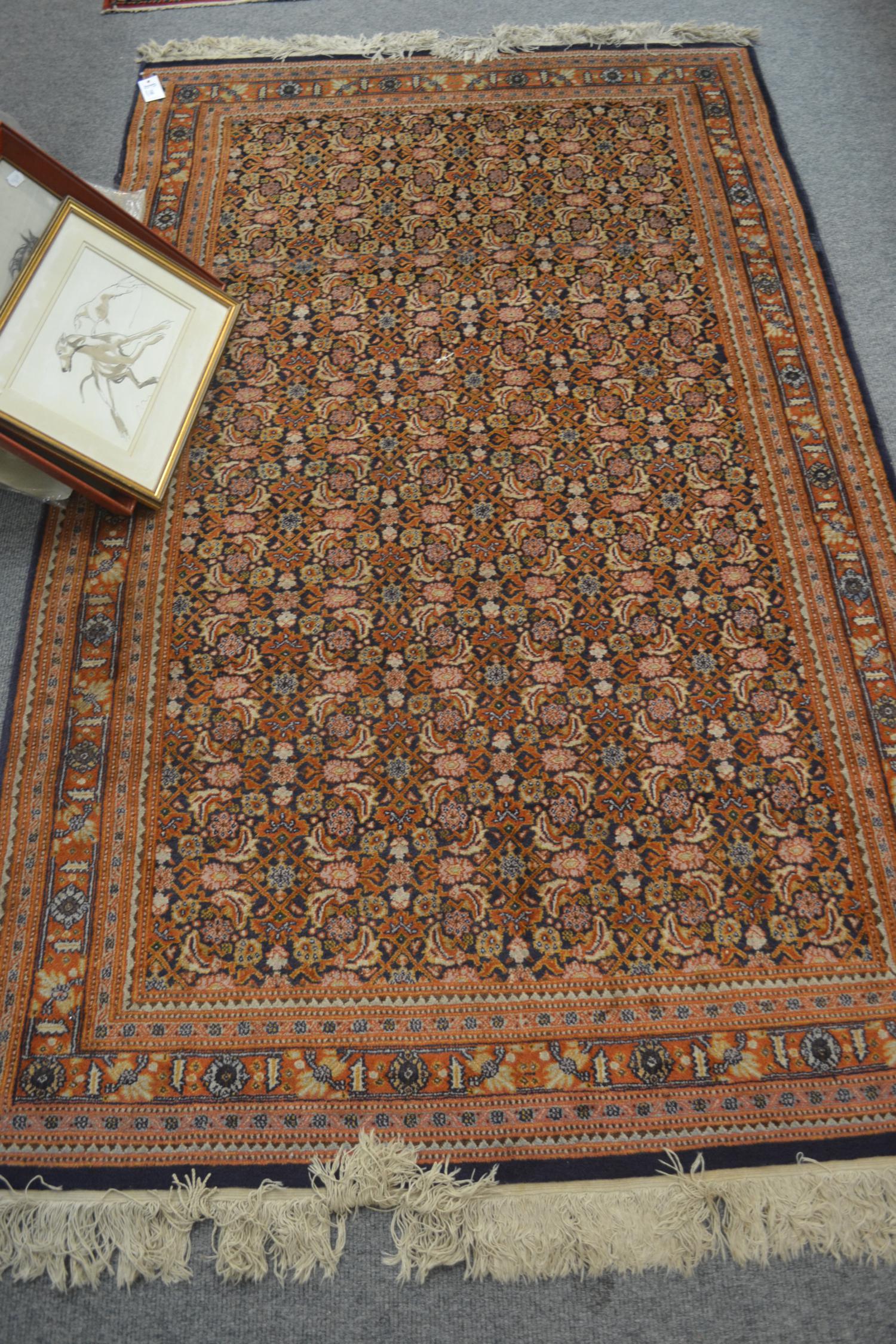 Tabriz rug, Persian Azerbaijan, the indigo Herati field enclosed by narrow terracotta borders, 212cm