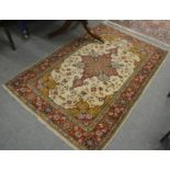 Lahore rug, Punjab, the ivory field of floral vines centred by a crimson medallion framed by