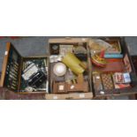 Two boxes including vintage toys, miniature longcase clock, coffee cans etc. together with an oak