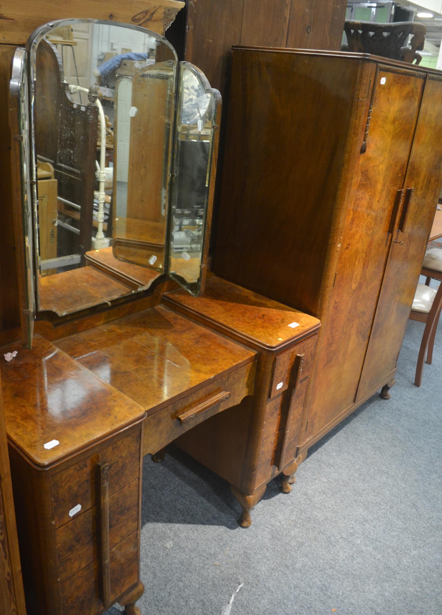 A 1930's walnut wardrobe and matching dressing table