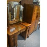 A 1930's walnut wardrobe and matching dressing table